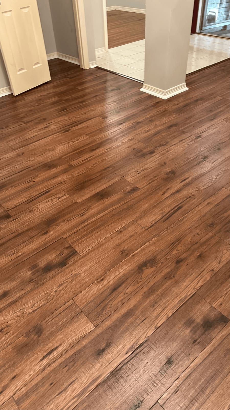 Rich hickory hardwood plank floor installed by Art & Floors