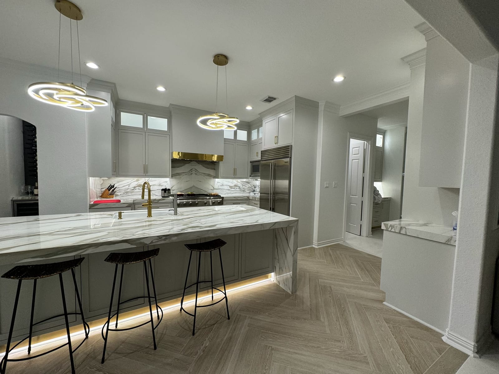 Marble waterfall island countertop by Art & Floors