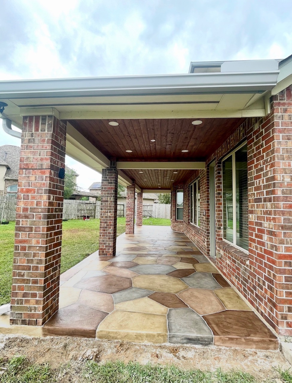 Covered patio — brick columns by Art & Floors near Webster, TX