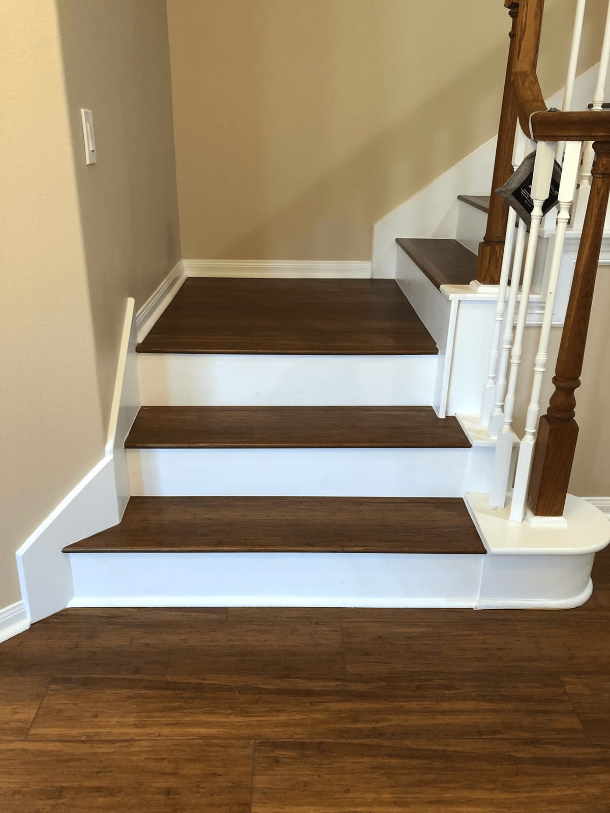Refinished wood stair treads with white risers